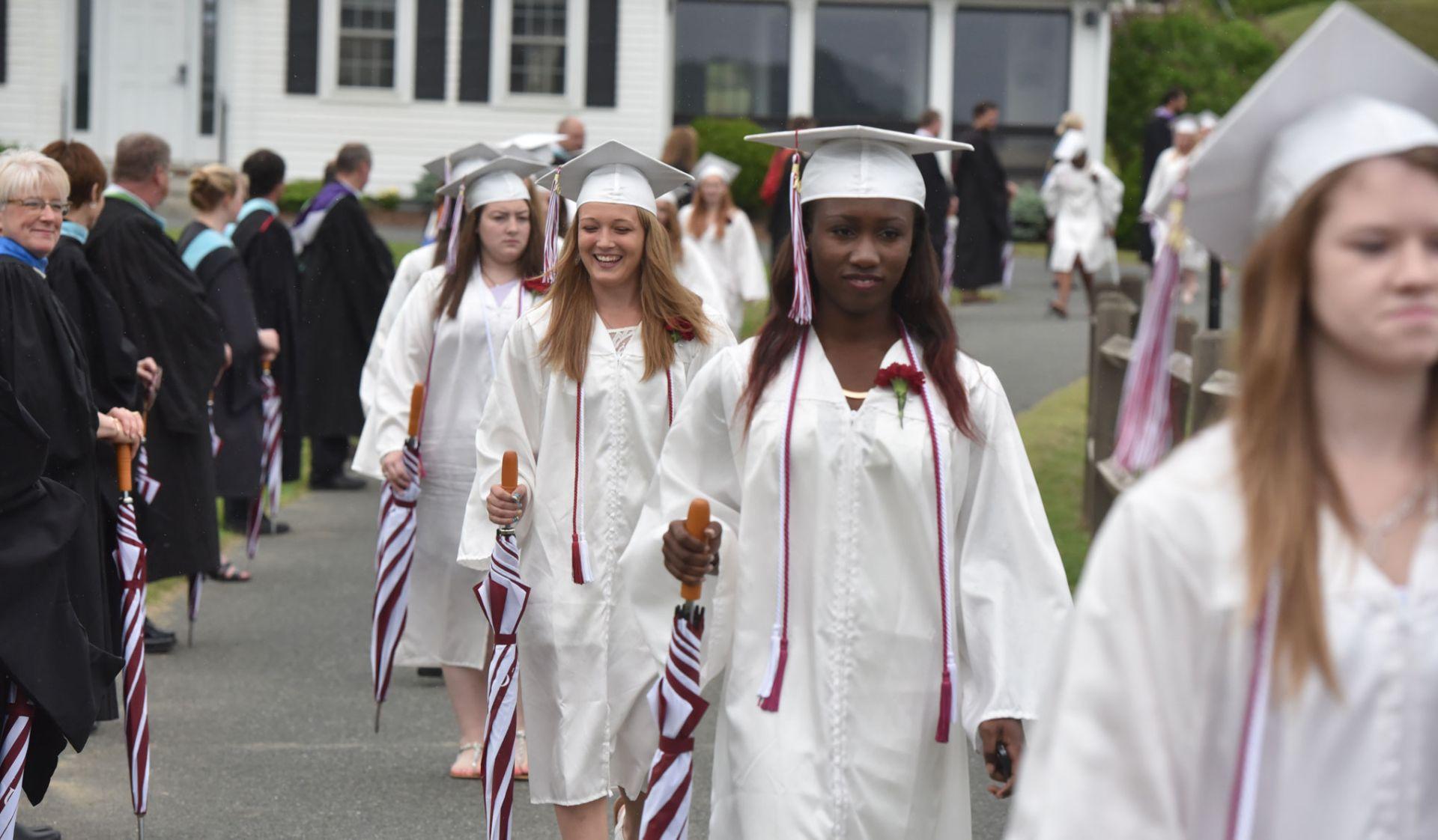 Students marching at graduation. 