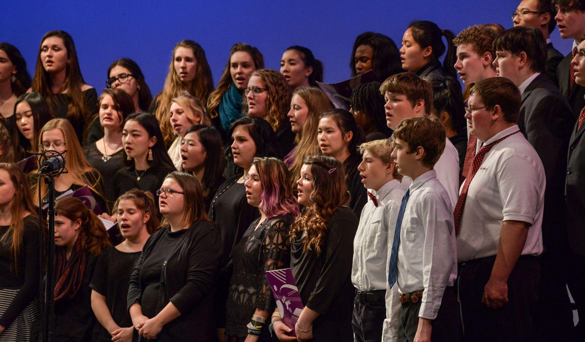 Students performing a choral song. 