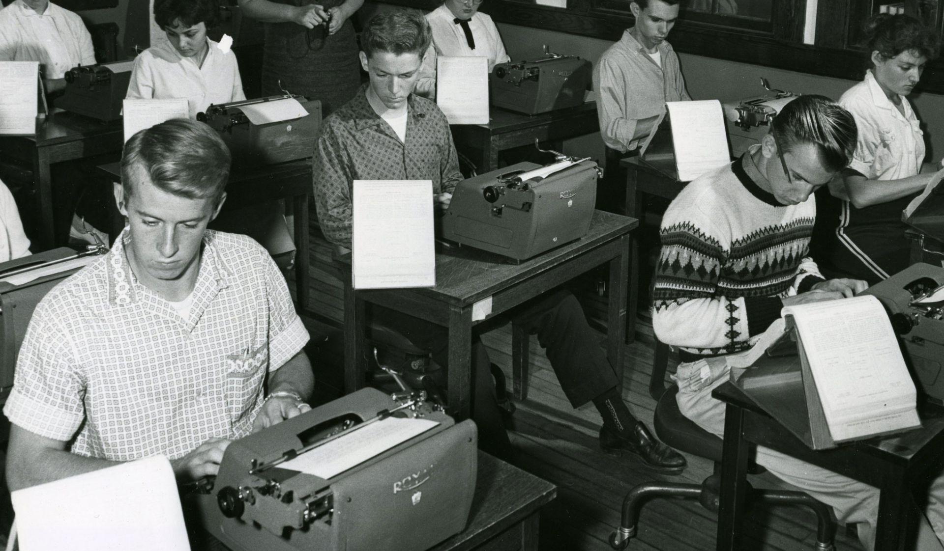 Historic photo of students in typing class. 