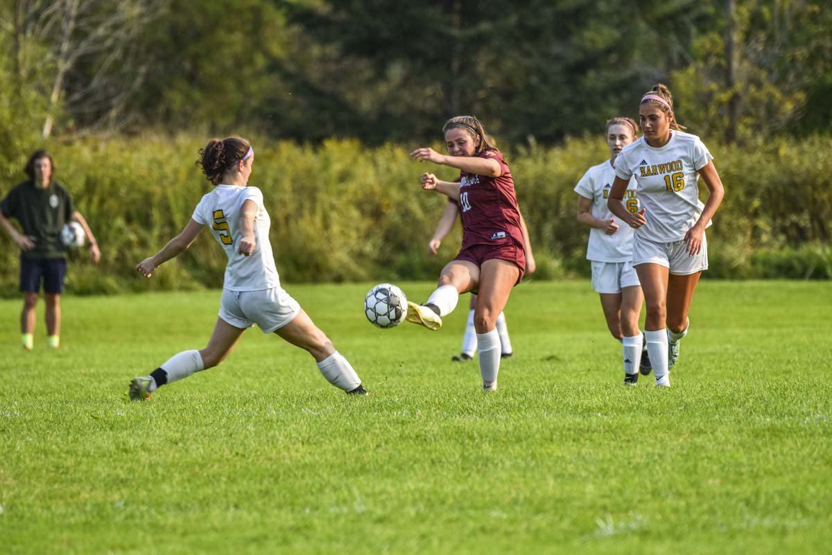 LI Girls Soccer team in action on the pitch. 